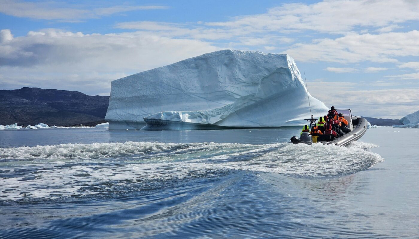 https://www.pexels.com/photo/adventurous-boat-tour-near-greenland-iceberg-35563535/