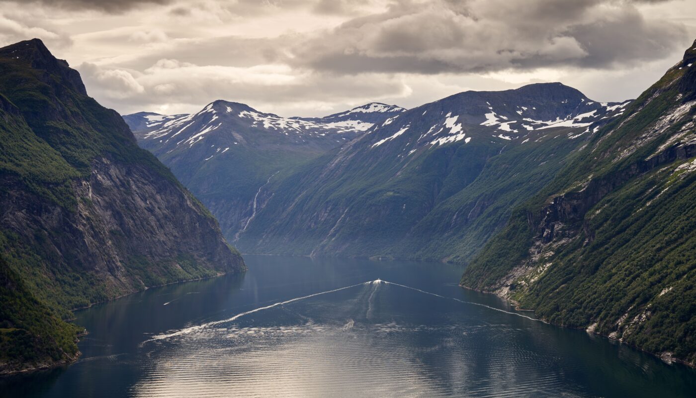 https://www.pexels.com/photo/snow-on-green-mountains-along-a-river-9246830/
