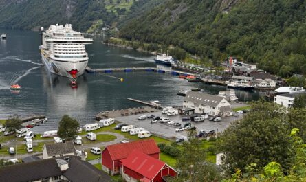 https://www.pexels.com/photo/cruise-ship-docked-in-scenic-norwegian-fjord-33692810/